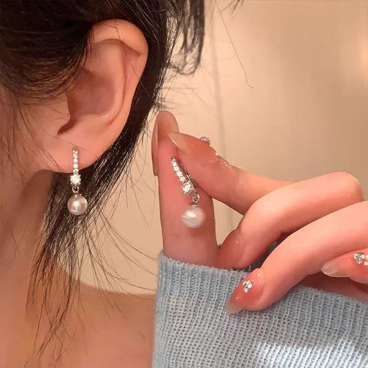 Eden™ Pearl Earrings — 999 sterling silver CZ and pearl drop huggie earrings by CHIVIQUE