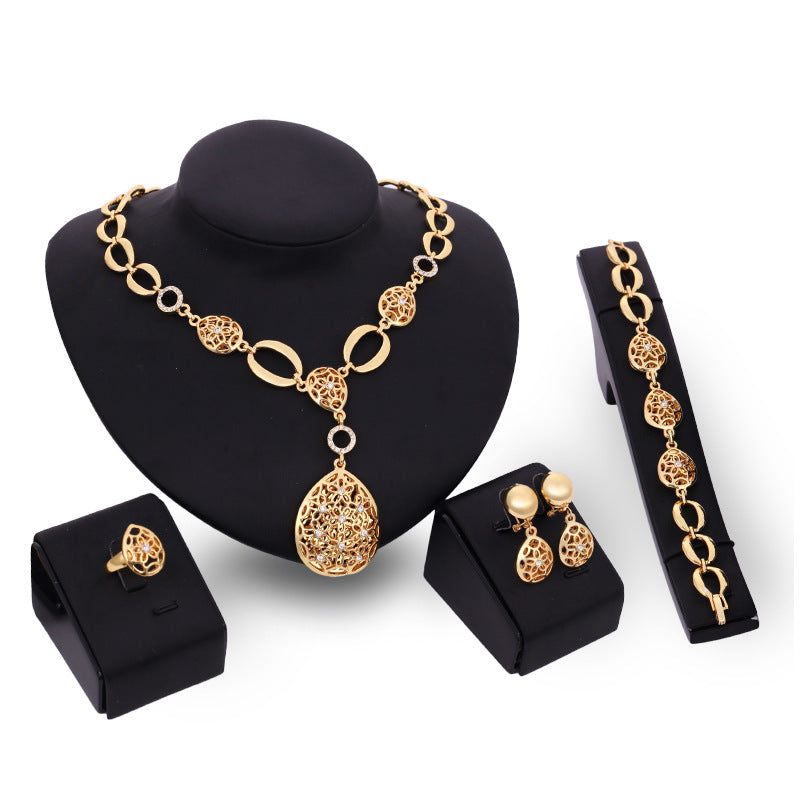 Aurelia Set gold necklace and earrings styled together