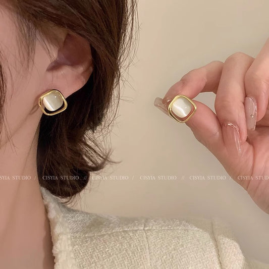 Aria™ Bow Earrings — dainty cubic zirconia bow huggie hoops by CHIVIQUE